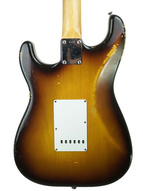 1959 Fender Custom Shop Stratocaster with a beautiful sunburst finish, highlighting its iconic slab board and vintage appeal.