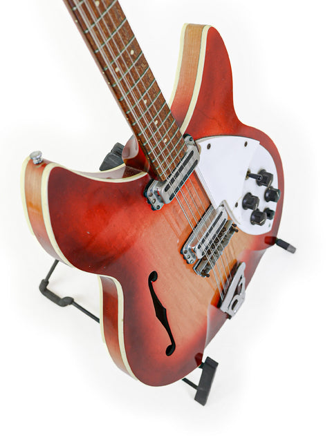 1965 USA-made Rickenbacker 12-string guitar with a striking red body and classic white pick guard.