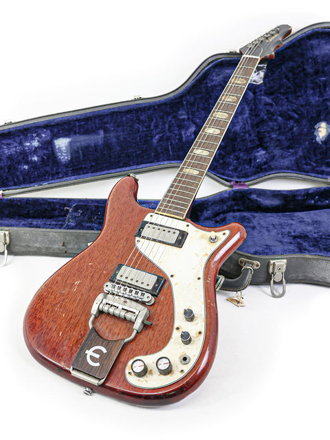 1966 Epiphone Crestwood Custom guitar and case, elegantly placed on a white surface.
