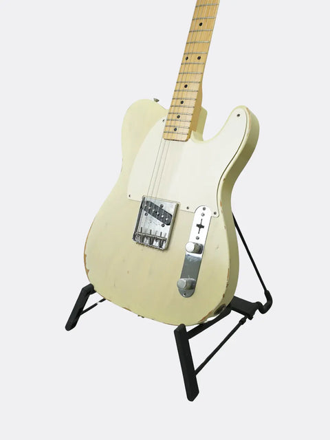 Fender Custom Shop '59 Esquire electric guitar on a stand against a white background