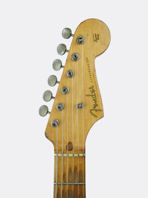 Fender Stratocaster headstock with Fender logo on a white background