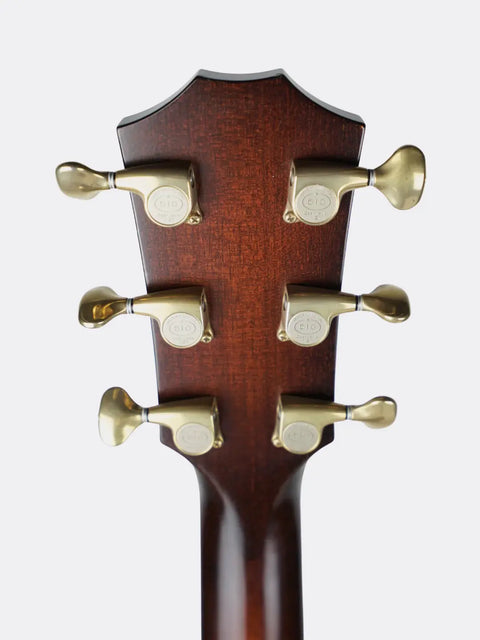 Close-up of a 2018 Taylor K14ce headstock with tuning pegs on a white background