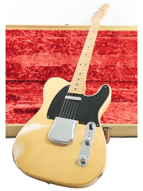 A 1998 Fender Custom Shop Cunetto Nocaster Relic guitar in yellow, showcasing a wooden body and neck.
