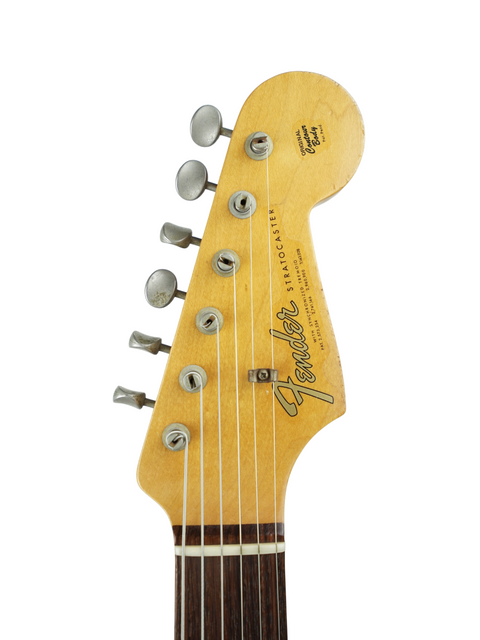 A Fender Custom Shop Limited '64 Stratocaster Relic, USA 2009, displayed prominently, highlighting its vintage appeal.