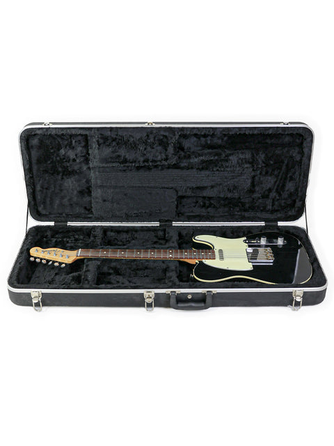 A Fender John English Master Built '59 Custom Telecaster in black and white, nestled in a protective guitar case.