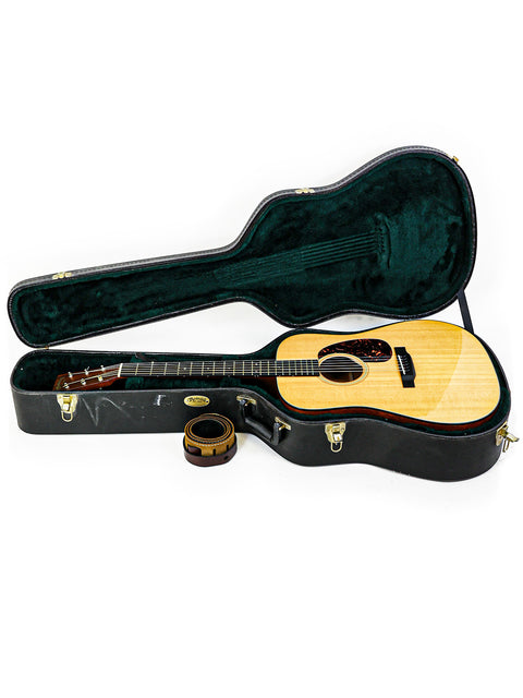 A Martin DM-2 acoustic guitar, model D-18, crafted in the USA in 2012, showcasing its elegant design and craftsmanship.