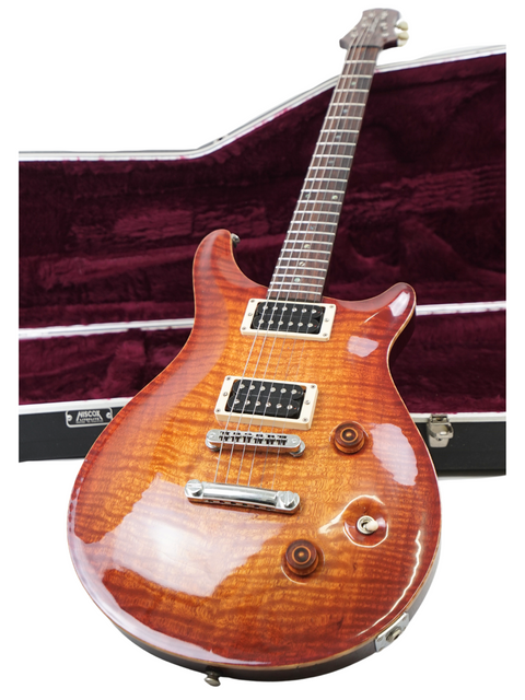 A PRS Custom 24 guitar in sunburst finish, featuring a Belman Double Cut Grand design from 2005.