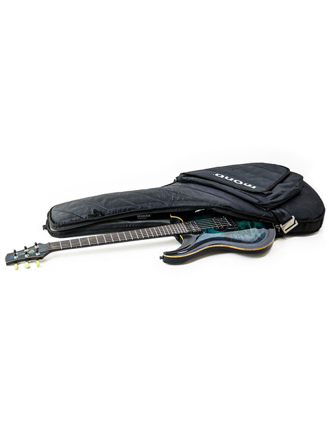A black-covered guitar case with an open lid revealing a guitar inside, labeled 'Orthius Deluxe DC - Australia 2018'.