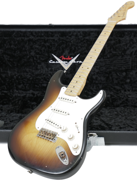 A black case containing a Fender Kyle McMillin Masterbuilt '57 Stratocaster, highlighting its premium quality and style.