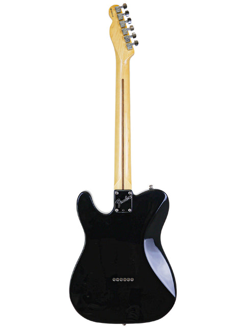 A black electric guitar with a wooden body, specifically a Fender Tele Plus V2 from the USA, 1999 model.