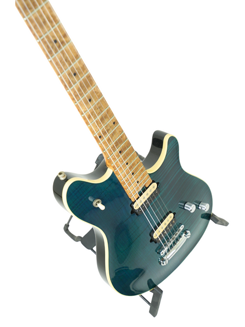 A blue Peavey EVH Wolfgang Standard Hardtail electric guitar resting on a stand, emphasizing its striking color and craftsmanship.