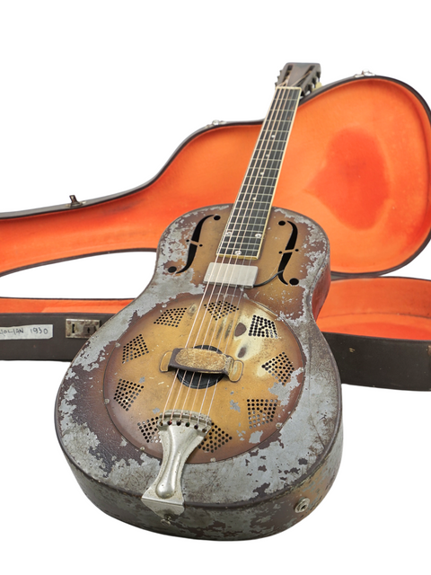 A classic 1930 National Triolian guitar inside its case, representing timeless craftsmanship and vintage appeal.