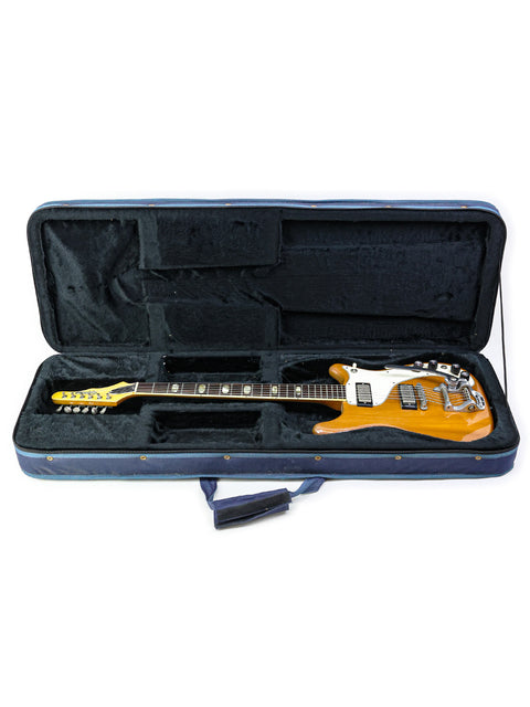 A classic 1964 Epiphone Crestwood Custom guitar in yellow rests inside a protective case, ready for its next performance.