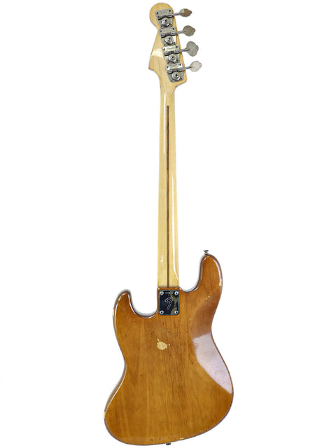 A classic 1974 Fender Jazz Bass guitar featuring a beautifully crafted wooden body and neck, perfect for any music lover.