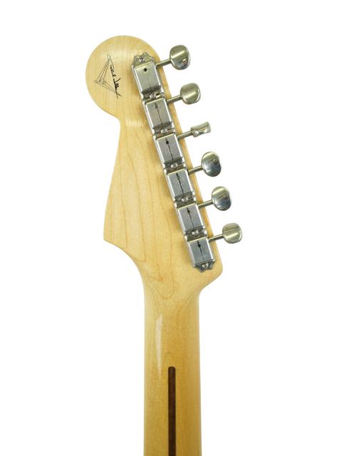 A close-up of the guitar head from a Fender Paul Waller Masterbuilt '56 Stratocaster, displayed on a white background.