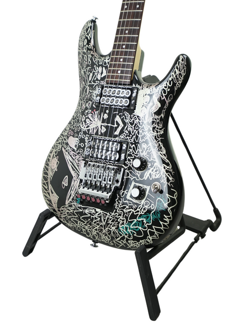 A graffiti-covered Ibanez Joe Satriani guitar, showcasing vibrant art on a limited edition model from Japan, 2008.