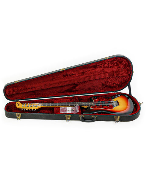 A red and black 1966 Fender Electric XII guitar is showcased inside a protective guitar case, looking ready to rock.