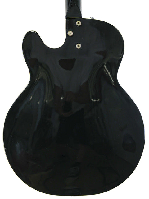 A sleek black Silvertone 1446 guitar featuring a white pick guard, representing vintage charm from 1961-65.