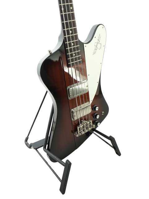 A striking black guitar with a brown neck, representing the Orville Thunderbird Bass in Tobacco Burst, crafted in Japan, 1988.