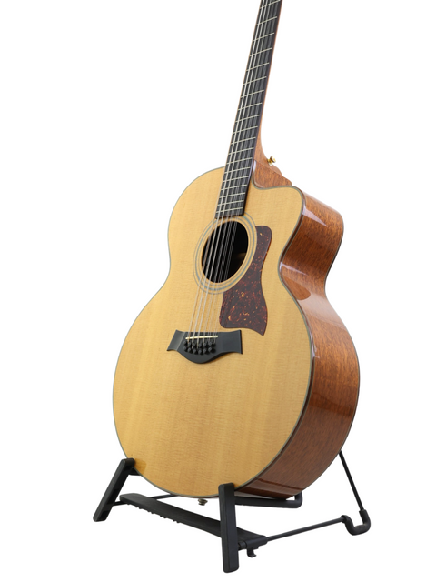 A stunning 1995 Taylor LKSM Leo Kottke 12-string acoustic guitar, known for its craftsmanship and beautiful wood grain.