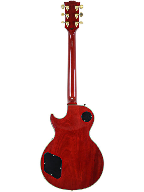 A vibrant red Les Paul Custom guitar from Gibson's Custom Shop, featuring a stylish black pickguard for a striking look.