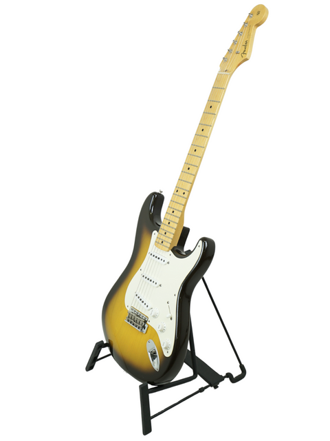 A vibrant yellow Fender '56 Stratocaster guitar on a stand, highlighting its Masterbuilt craftsmanship from 2020.