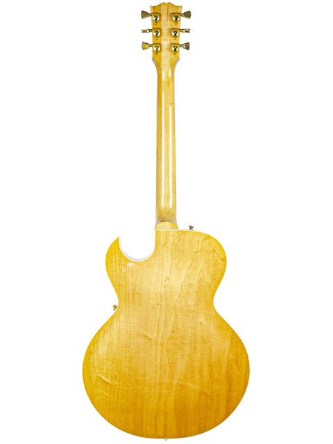 A vibrant yellow Gibson ES-135 guitar from 2002, highlighting its sleek body and neck in a captivating visual.