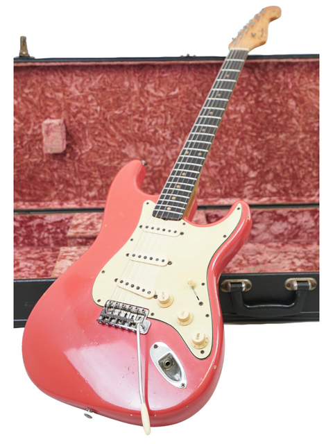 A vintage 1963 Fender Stratocaster in Fiesta Red, securely housed in a case, once belonging to renowned guitarist Phil Emmanuel.