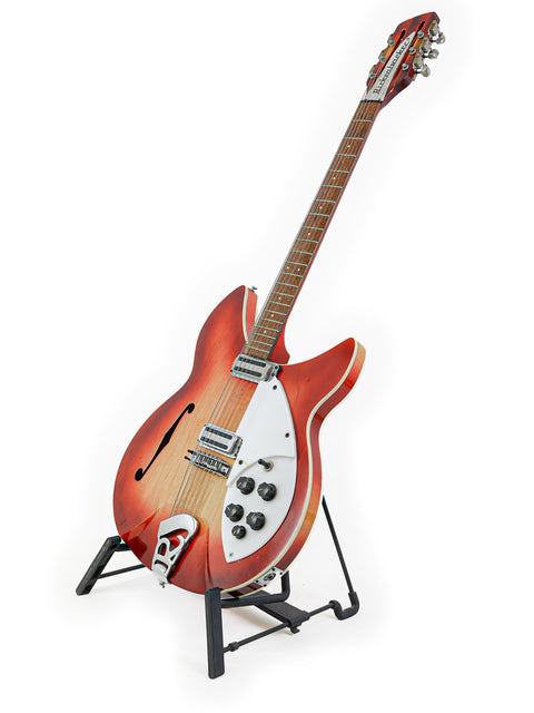 A vintage 1965 Rickenbacker 1993 Rose Morris 12-string guitar on a stand, emphasizing its unique design and historical significance.