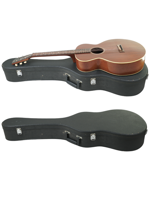 A vintage Gibson L-0 guitar from 1929 is elegantly positioned on its case, emphasizing its timeless appeal and artistry.