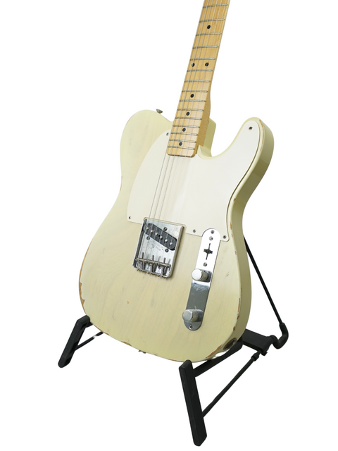 A white electric guitar, the Fender Custom Shop '59 Esquire Journeyman Relic from 2003, elegantly positioned on a stand.