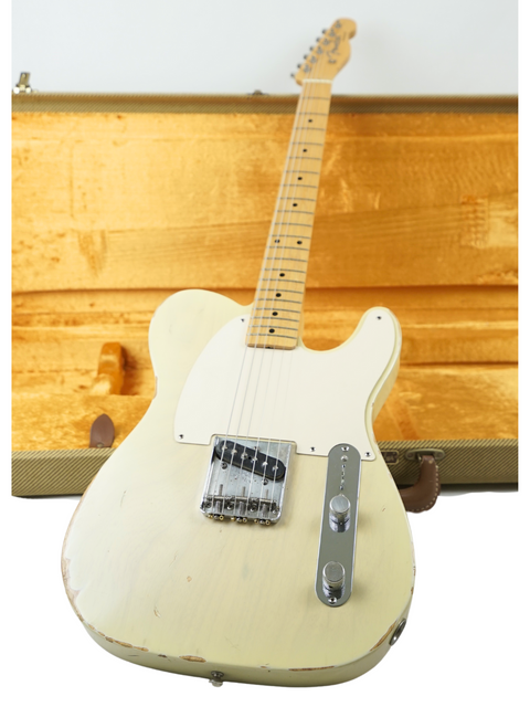 A white guitar, the Fender Custom Shop '59 Esquire Journeyman Relic from 2003, elegantly resting in a wooden case.