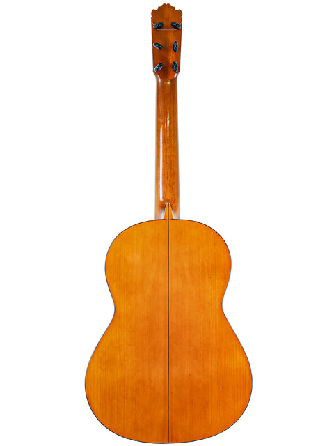 Acoustic guitar's wooden back displayed, showcasing craftsmanship with M.G. Contreras, Calle Mayor 80, Spain, 1973.