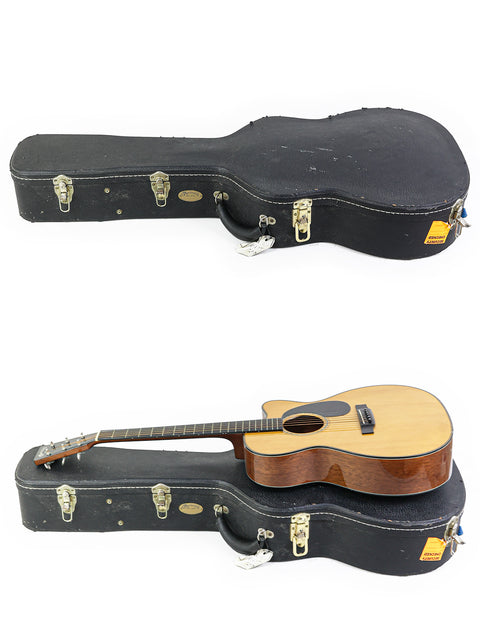 An acoustic guitar and its case, featuring the Martin 000-C David Gray Custom prototype, highlighting its exclusive design.
