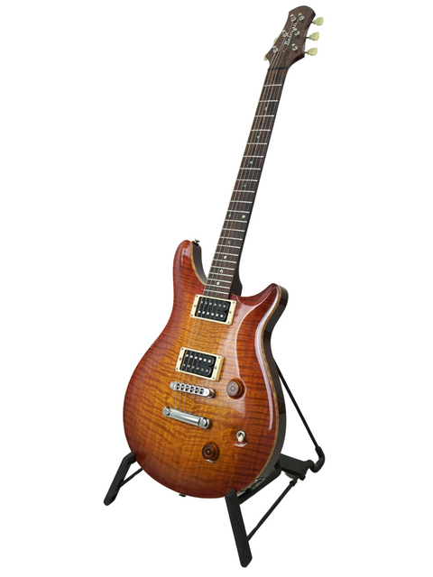Angled view of the Belman Double Cut Grand guitar on a stand, capturing its elegant curves and high-gloss finish.