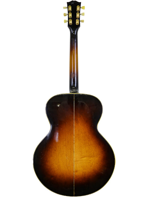 Back of a 1952 Gibson J-185 acoustic guitar with a rich sunburst finish, emphasizing its vintage appeal.