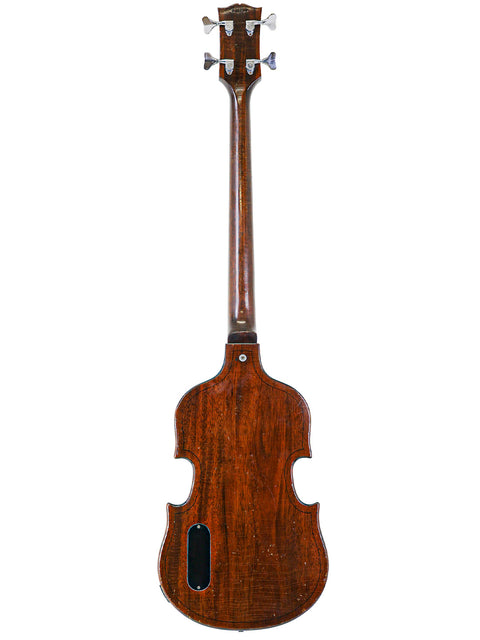 Back of a 1969 Gibson EB-1 guitar, emphasizing its elegant wooden body and vintage charm.