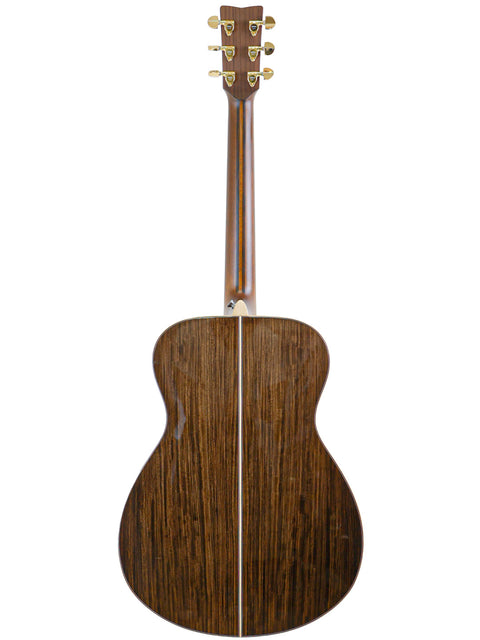 Back of a Yamaha LS36 ARE acoustic guitar, displaying its elegant wooden back, crafted in Japan in 2020.