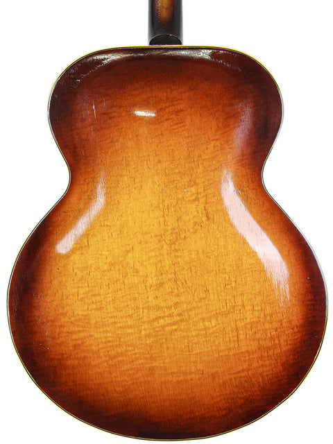 Back of a vintage Gibson ES-300 guitar from 1946, featuring a rich sunburst finish that highlights its classic design.