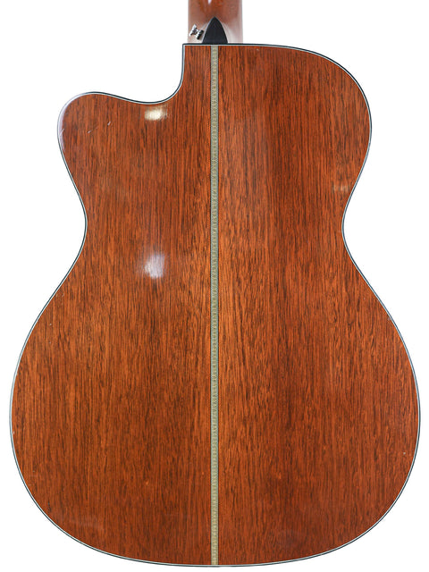 Back view of a Martin 000-C David Gray Custom acoustic guitar, showcasing its elegant wooden back from 2004.