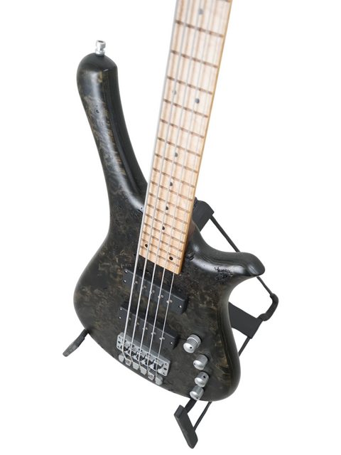 Black electric bass guitar on a stand, the Warwick Fortress Limited Edition Nirvana 5-String, crafted in Germany, 2014.