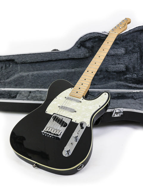 Black electric guitar, Fender Tele Plus V2 (1999), in a case, set on a clean white background.