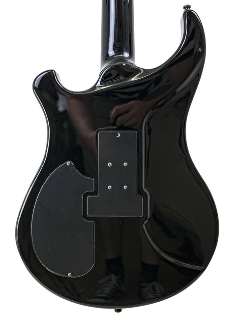 Black electric guitar featuring a black pickguard, model Orthius Deluxe DC, crafted in Australia in 2018.
