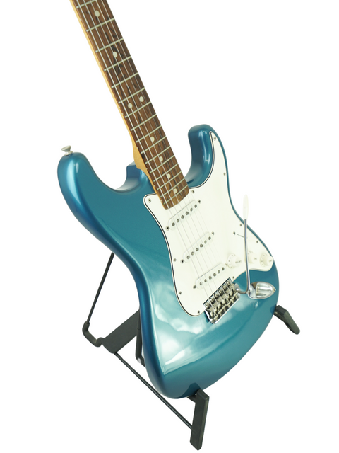Blue 1965 L Series Fender Stratocaster electric guitar showcased on a stand, highlighting its vintage design.