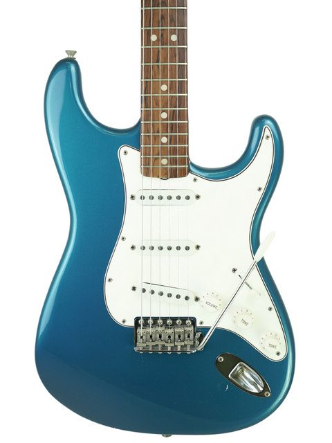 Blue electric guitar, a 1965 Fender Stratocaster, featuring a white pickguard, exemplifying vintage American artistry.