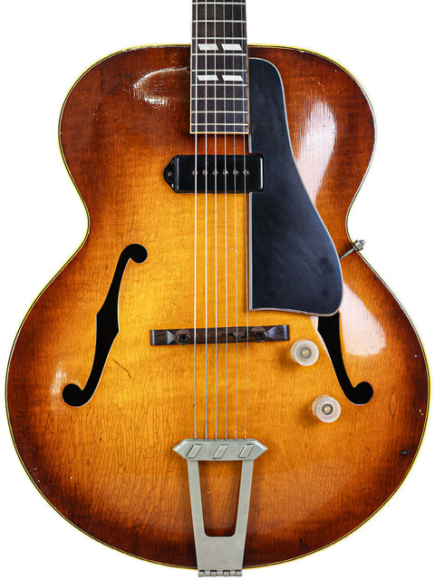 Classic 1946 Gibson ES-300 guitar with a striking sunburst finish, embodying vintage charm and musical history.