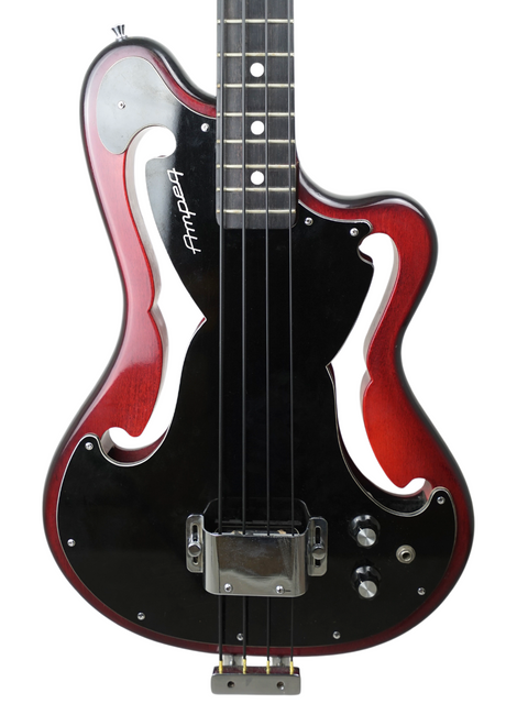 Classic 1966 Ampeg AEB-1 bass guitar in black and red, highlighted by a bold black headstock, ideal for vintage collectors.