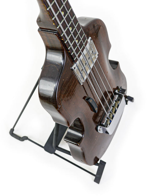 Classic 1969 Gibson EB-1 guitar on a stand, embodying timeless style and musical heritage.