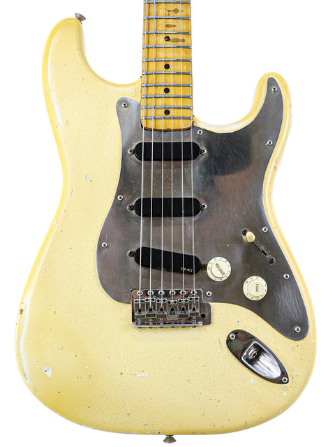 Classic 1974 Fender Stratocaster in vibrant yellow, complemented by a stylish black pickguard, ideal for rock enthusiasts.