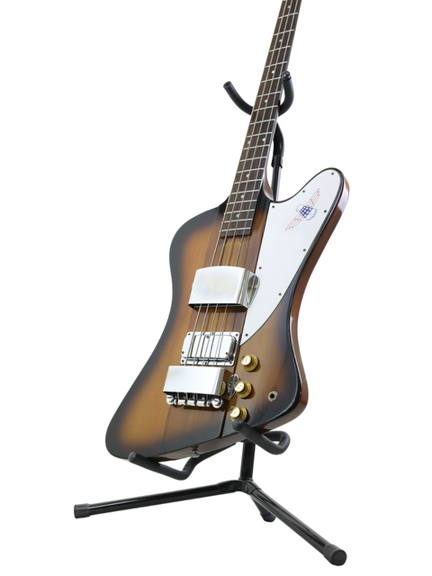 Classic 1976 Gibson Bicentennial Thunderbird IV Bass guitar on a stand, elegantly presented with a white background.